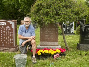 Stu Wilson tends to his mother's Beechwood Cemetery grave. The inscription on Gloria Wilson's headstone is original, written by a friend: 'Whose unselfish life was a gift of God, bursting with courage, wrapped in beauty, she robed this earth in smiles.'
