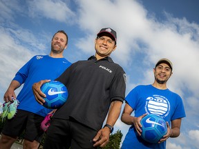 From left: Craig Stead, director of soccer operations and community engagement with Ottawa South United Soccer; Ottawa Police Services acting staff sergeant Fernando Vieira; and Zaid Al-Shorafat, employment counsellor, sport and recreation lead with the Catholic Centre for Immigrants. The trio has come together to help distribute soccer balls and cleats to youth in underprivileged neighbourhoods.