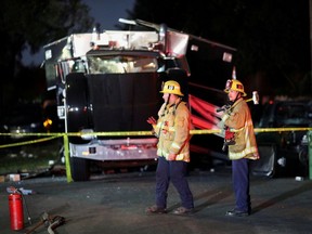 A damaged vehicle is seen at the site of an explosion after police attempted to safely detonate illegal fireworks that were seized, in Los Angeles.