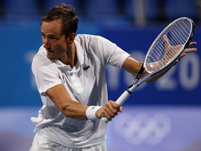 Daniil Medvedev of the Russian Olympic Committee team plays a backhand during his Men's Singles Quarterfinal match against Pablo Carreno Busta of Team Spain on day six of the Tokyo 2020 Olympic Games at Ariake Tennis Park on July 29, 2021 in Tokyo, Japan.