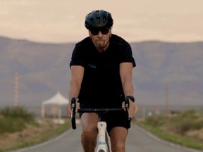 In a still image from a video, Richard Branson is depicted as arriving by bicycle to Spaceport America near Truth or Consequences, New Mexico, U.S. on July 5, 2021.