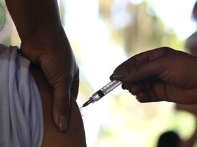 A patient receives a COVID-19 vaccine.