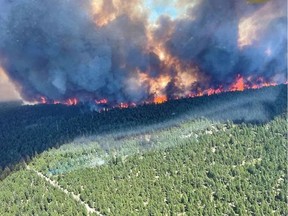 This handout photo courtesy of BC Wildfire Service shows the Sparks Lake wildfire, British Columbia, seen from the air on June 29, 2021.