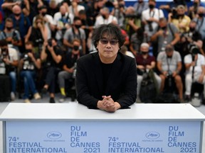 South Korean director Bong Joon-Ho poses during a photocall for the "Rendez-Vous With" at the 74th edition of the Cannes Film Festival in Cannes, southern France, on July 7, 2021.