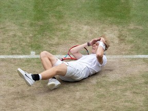 Canada's Denis Shapovalov wins match point against Russia's Karen Khachanov during their men's quarter-finals match on the ninth day of the 2021 Wimbledon Championships