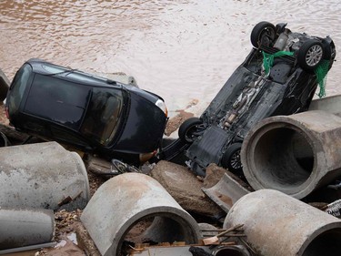 Cars lie in the rubble in an area completely destroyed by the floods in the Blessem district of Erftstadt, western Germany, on July 16, 2021.