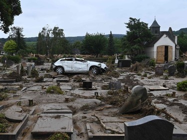 A destroyed car is pictured at the cemetery in Bad Neuenahr-Ahrweiler, western Germany, on July 16, 2021, after heavy rain hit parts of the country, causing widespread flooding.