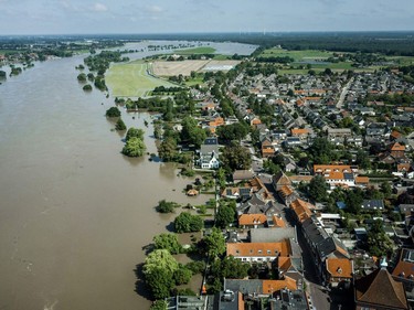 This aerial photograph taken above the Maas river shows the extend of the flood waters near the evacuated town of Arcen on 17 July 2021.