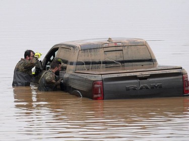 Soldiers of the German armed forces Bundeswehr search for flood victims in submerged vehicles on the federal highway B265 in Erftstadt, western Germany, on July 17, 2021, after heavy rains hit parts of the country, causing widespread flooding and major damage.