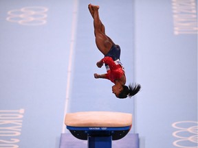 Files: US's Simone Biles competes in the vault event of the artistic gymnastics women's team final during the Tokyo 2020 Olympic Games at the Ariake Gymnastics Centre in Tokyo on July 27, 2021.