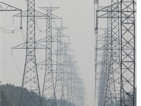 High power transmission lines in hazy weather conditions on Monday, Jul. 19, 2021.
