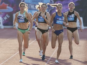 Madeleine Kelly, second left, leads Lindsey Butterworth (4), Melissa Bishop-Nriagu (5) and Adrea Propp to the finish line to win the women's 800-metre final at the Canadian track and field championships in Montreal in July 2019.