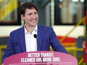 Lots to smile about: Prime Minister Justin Trudeau announces federal help for the Green Line LRT project in Calgary on July 7.