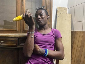 Patricia, one of two transgender women who were convicted in May of "attempted homosexuality," reacts after her release in Douala, Cameroon July 16, 2021.
