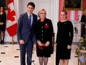 Carolyn Bennett poses with Prime Minister Justin Trudeau and then-governor general Julie Payette after being presented as Minister of Crown-Indigenous Relations on Nov. 20, 2019. Payette is gone, and Bennett is in hot water.