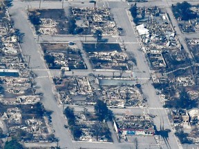 The charred remnants of homes and buildings, destroyed by a wildfire on June 30, are left behind in Lytton, British Columbia, Canada July 6, 2021, as seen in this aerial photograph.