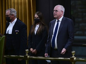 President of the Public Health Agency of Canada  Iain Stewart, right, approaches the bar in the House of Commons to be admonished by the Speaker of the House of Commons Anthony Rota on Parliament Hill on June 21, 2021.