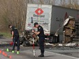 Ontario Provincial Police traffic accident reconstructionists investigate the scene of a three vehicle crash that killed four people and seriously injured two others overnight Thursday May 11 2017 on Hwy. 401 westbound lanes just west of Joyceville Road, east of Kingston.