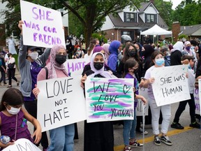 Members of the Muslim community and supporters gather for a vigil at the London Muslim Mosque in London, Ont., on June 8.