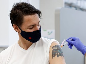 Prime Minister Justin Trudeau receives his second COVID-19 vaccine at a pharmacy in Ottawa Friday morning