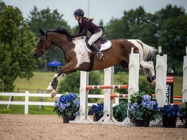 Wesley Clover Parks and the Ottawa Equestrian Tournaments host the Ottawa Summer Tournaments world class show jumping competition on Saturday, July 17, 2021. Eve Desrochers and Rock N'Roll took part in the events Saturday. 

ASHLEY FRASER, POSTMEDIA