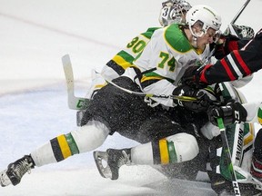 Ben Roger (74) gets involved in a collision with teammates and Jonah De Simone of the Niagara Ice Dogs in an Ontario Hockey League game on Oct. 27, 2019.