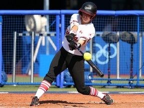 Kelsey Harshman #1 of Team Canada singles to left field in the fourth inning against Team Japan during the Softball Opening Round.