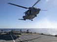 FILE: The Cyclone helicopter that crashed off the coast of Greece on April 29 is shown in this Feb. 15 photo operating from HMCS Fredericton. Six Canadian Forces members died in the crash.