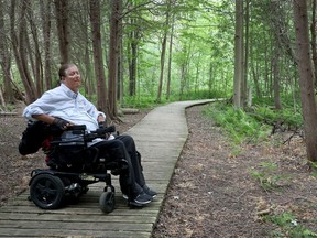Mike Nemesvary, a quadraplegic, enjoys the Baxter Conservation Area along the Rideau River. He's part of a group raising money to make it accessible for everyone.
