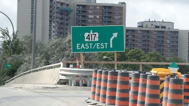 The westbound Queensway entrance at Greenbank/Pinecrest roads shows an eastbound sign.