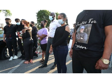Family, friends and the community gathered on York Street to hold a vigil for Loris Tyson Ndongozi on Tuesday. Ndongozi, 20, was fatally shot Sunday night in Ottawa in what his family called the senseless killing of a gentle giant.