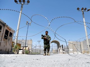 An Afghan National Army soldier stands guard at the gate of Bagram U.S. air base, on the day the last of American troops vacated it, Parwan province, Afghanistan July 2, 2021.