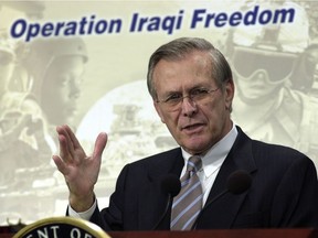 FILE PHOTO: Donald H. Rumsfeld, Secretary of Defense briefs the Press at the Pentagon, March 21, 2003.