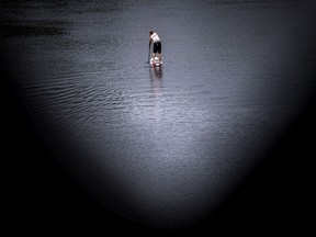 A paddler makes his way past the Wakefield Covered Bridge in the Gatineau River.