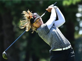 Brooke Henderson watches her drive from the 9th tee in round 3 of the women's golf individual stroke play at the Tokyo Olympics on Friday.