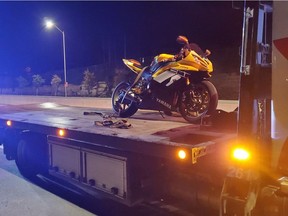 Motorcycle being impounded by police