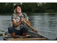 Algonquin storyteller and spiritual guide Albert Dumont basks in the healing surroundings of the Rideau River as he paddles from Dutchie's Hole Park canoe launch in late July.