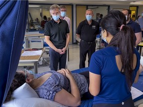 Rod Phillips, Ontario minister of long-term care, talks with personal support worker students at Algonquin College this past summer.