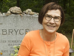 Cindy Blackstock, executive director of the First Nations Child and Family Caring Society of Canada, at the Beechwood Cemetery grave of Peter Bryce, who in 1922 published a report detailing conditions at Canada's residential schools.