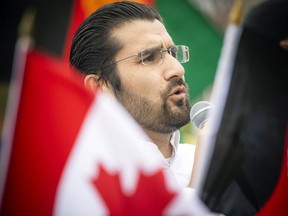 Kazim Hizbullah speaks at a rally of Afghan Canadians on Parliament Hill Saturday.