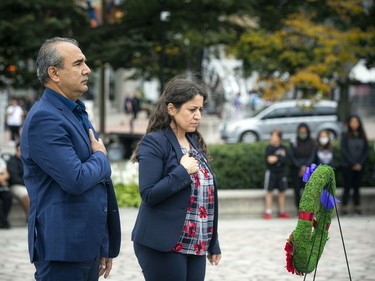 The Afghan-Canadian community held a small ceremony at The National War Memorial to honour veterans' sacrifices during the war in Afghanistan. Tawab Lodin, left, and Shokoufa Toukhi placed a wreath during the memorial event.