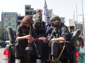 Taliban members patrol the streets of Jalalabad, Afghanistan, on Tuesday.