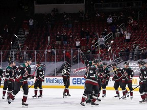 FILE: The Arizona Coyotes salute their fans.