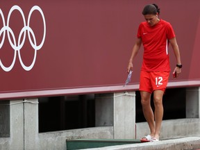 Christine Sinclair of Team Canada walks into the team tunnel after inspecting the pitch ahead of the Women's Football Semifinal match between USA and Canada at Kashima Stadium on August 02, 2021 in Kashima, Ibaraki, Japan.