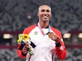Gold medallist Damian Warner of Team Canada stands on the podium during the medal ceremony for the men's decathlon at the Tokyo Olympic Games, on Aug. 6, 2021.