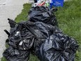 File photo: Garbage and recycling waiting for pickup in downtown Ottawa.