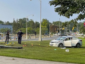 Ottawa police investigate a single vehicle crash on the Queen Elizabeth Driveway near Dow's Lake. Friday, Aug. 20, 2021.