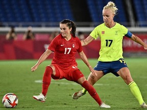 Canada's midfielder Jessie Fleming, left, fights for the ball with Sweden's midfielder Caroline Seger during the Tokyo 2020 Olympic Games women's final football match between Sweden and Canada at the International Stadium Yokohama in Yokohama on August 6, 2021.