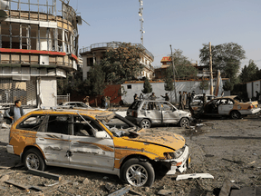 Damaged cars are seen at the site of a car bomb blast in Kabul, Afghanistan, on August 4, 2021. The Taliban has been resurgent since the recent withdrawal of American troops.
