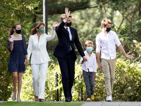 Canada's Prime Minister Justin Trudeau salutes as he attends Rideau Hall with his wife Sophie Gregoire and their children Ella-Grace, Xavier and Hadrien, to speak with Governor General Mary Simon in Ottawa, Ontario, Canada, August 15, 2021.